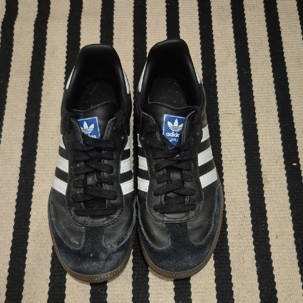 Adidas Black and White Athletic Shoes with Iconic Stripes